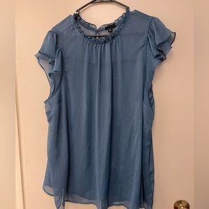 Sheer blue top with silver thougout